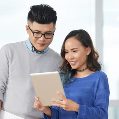 business-couple-with-tablet 1